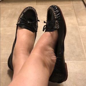 Black patent-leather Coach flats